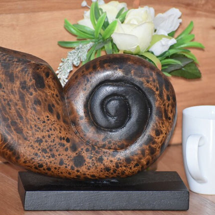 Decorative hand carved wooden shell on stand