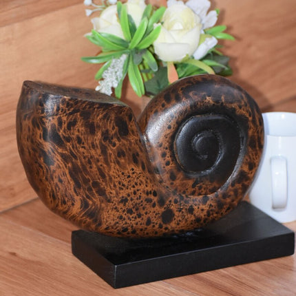 Decorative hand carved wooden shell on stand