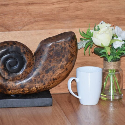 Decorative hand carved wooden shell on stand